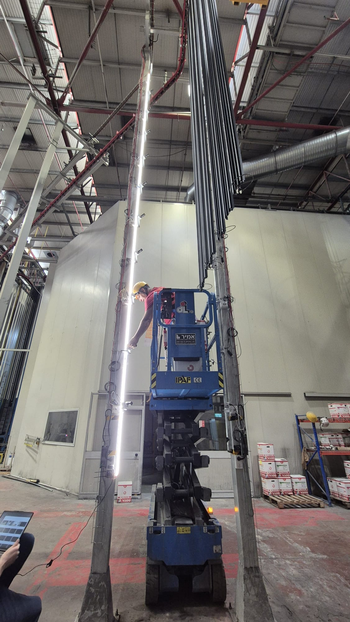 Agentix camera installation — scissor lift installation of the camera tower at an aluminum production facility